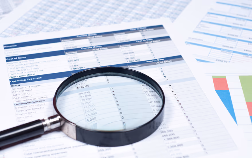 A magnifying glass over financial statements